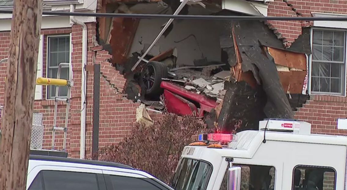 Porsche crashes into building's second floor